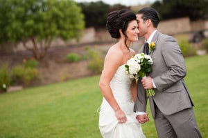 A bride and groom kissing on their wedding day at Holland Ranch