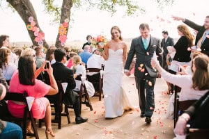 A photo of the new couple after they get married on the Robert Hall Winery terrace