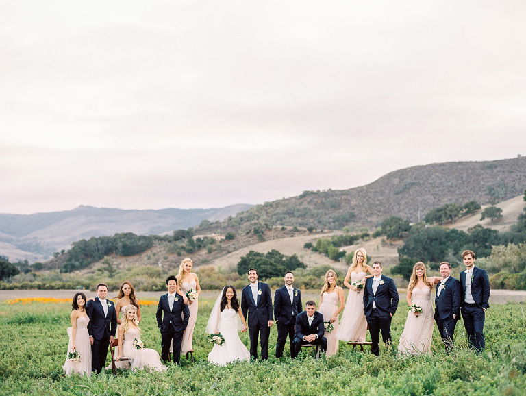 Large bridal party in the open field at Apple Creek Ranch