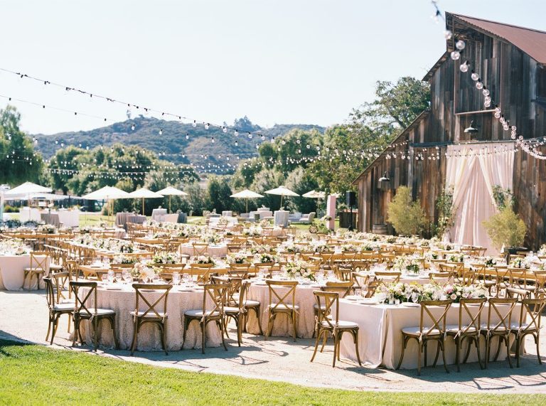 Wedding reception in front of the rustic barn