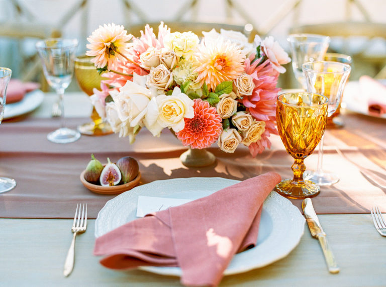Colorful wedding reception tablescape and place setting