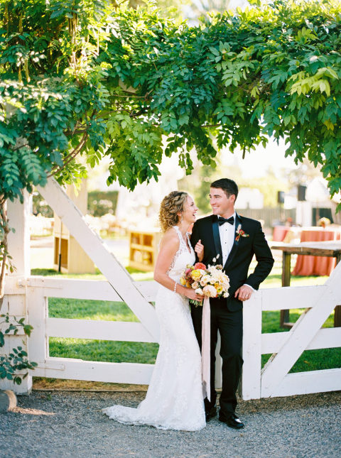 Newlyweds, Whitney and Shane celebrating in front of Mattei's Tavern after their wedding